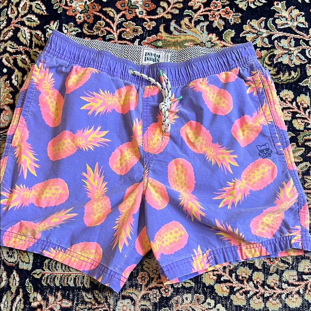 Purple and pink pineapple party pants swim trunks